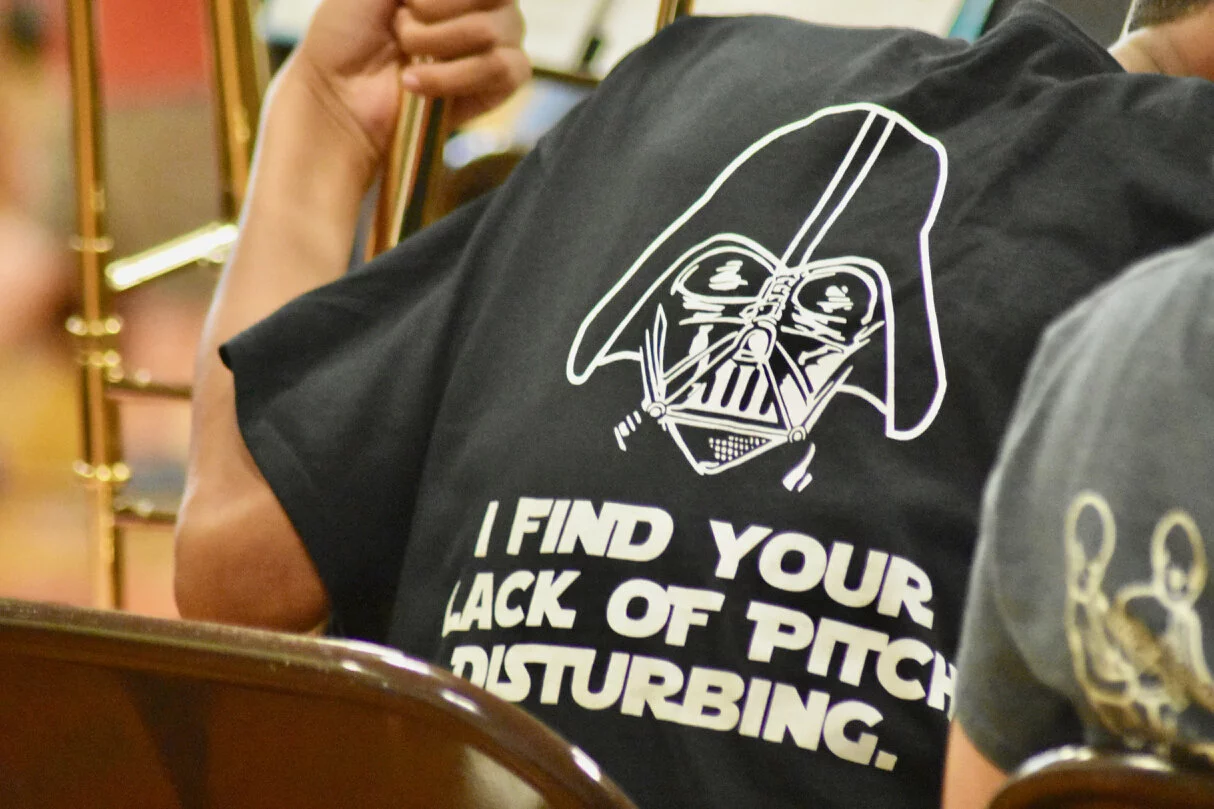 back of a student wearing a Star Wars inspired band tshirt