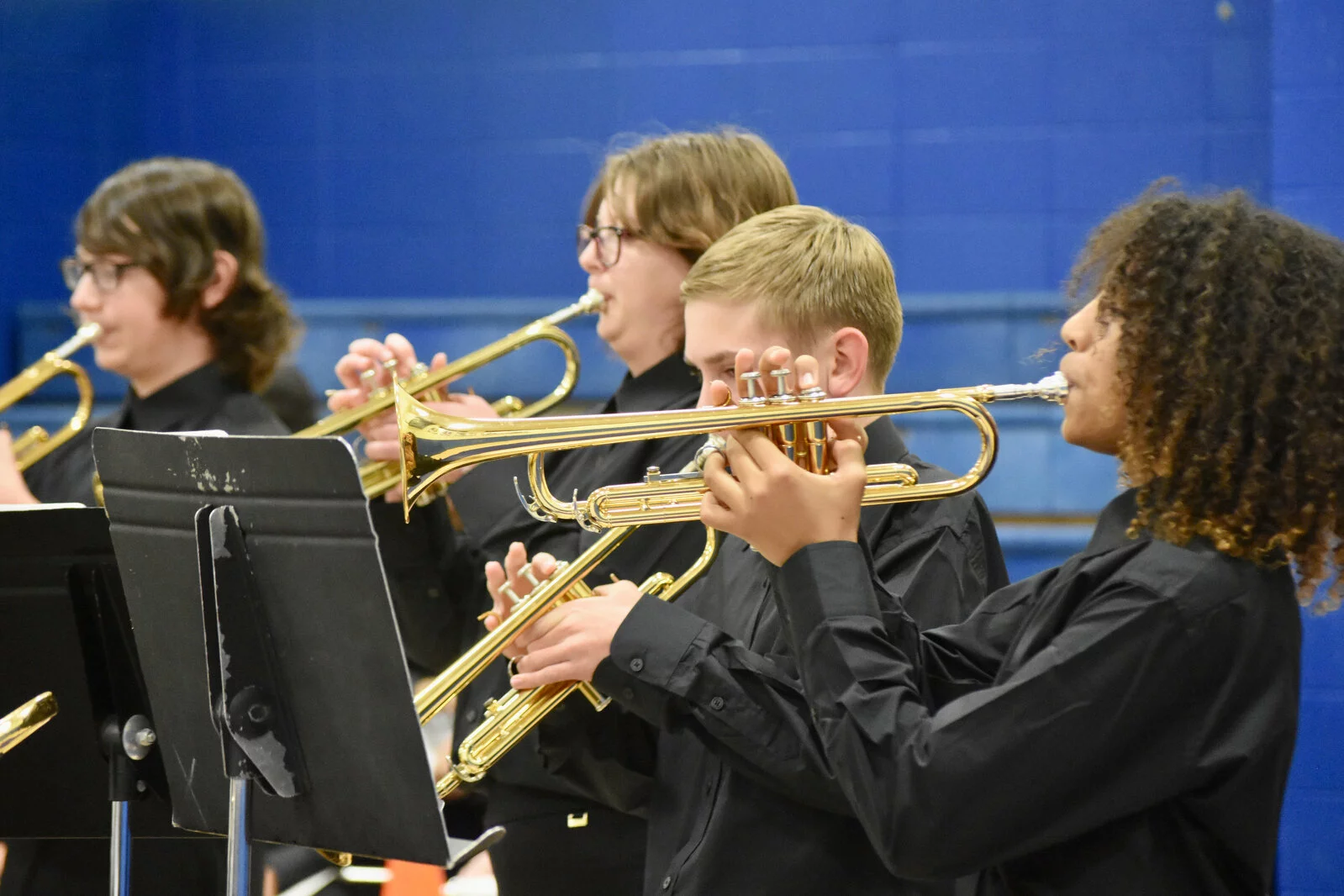 Trumpet section playing at fall band concert