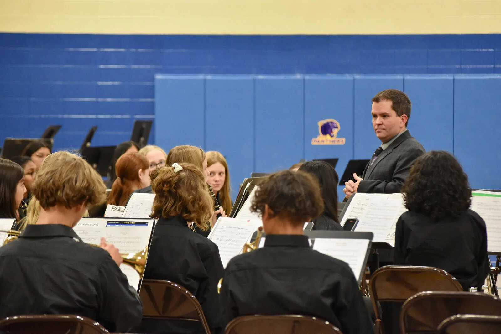 Director Steve Thomas directs the band at the fall band concert